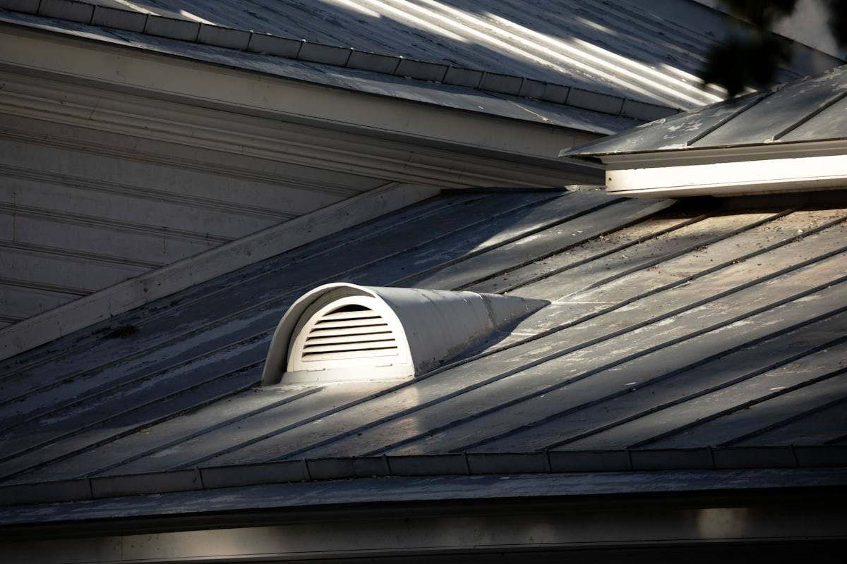 Pipework being fitted in an attic, the location of many residential radon fans