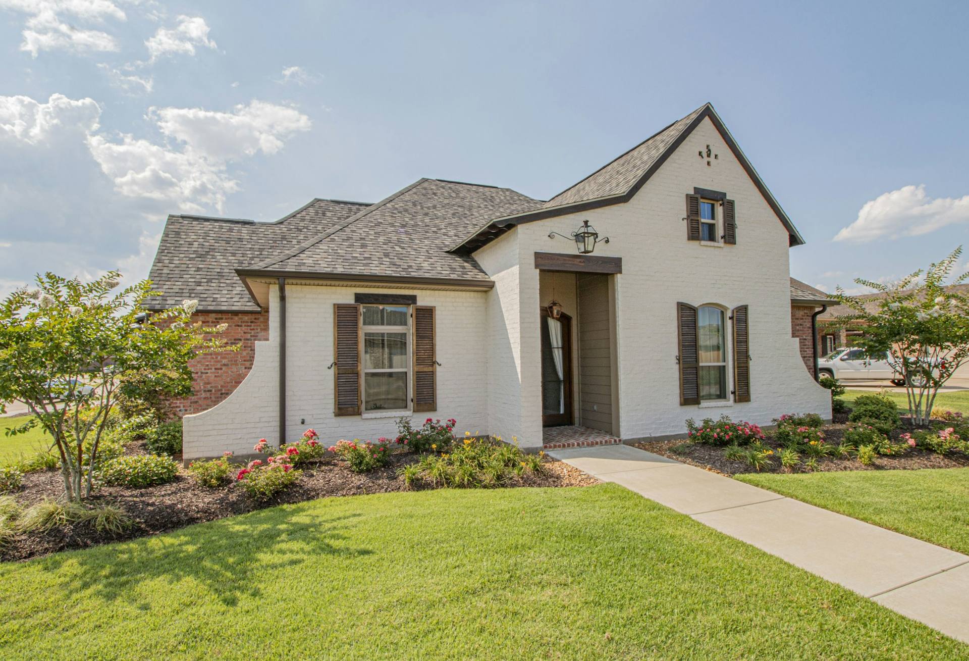 Well-maintained Cincinnati-area home with landscaped lawn and foundation suitable for radon testing and mitigation